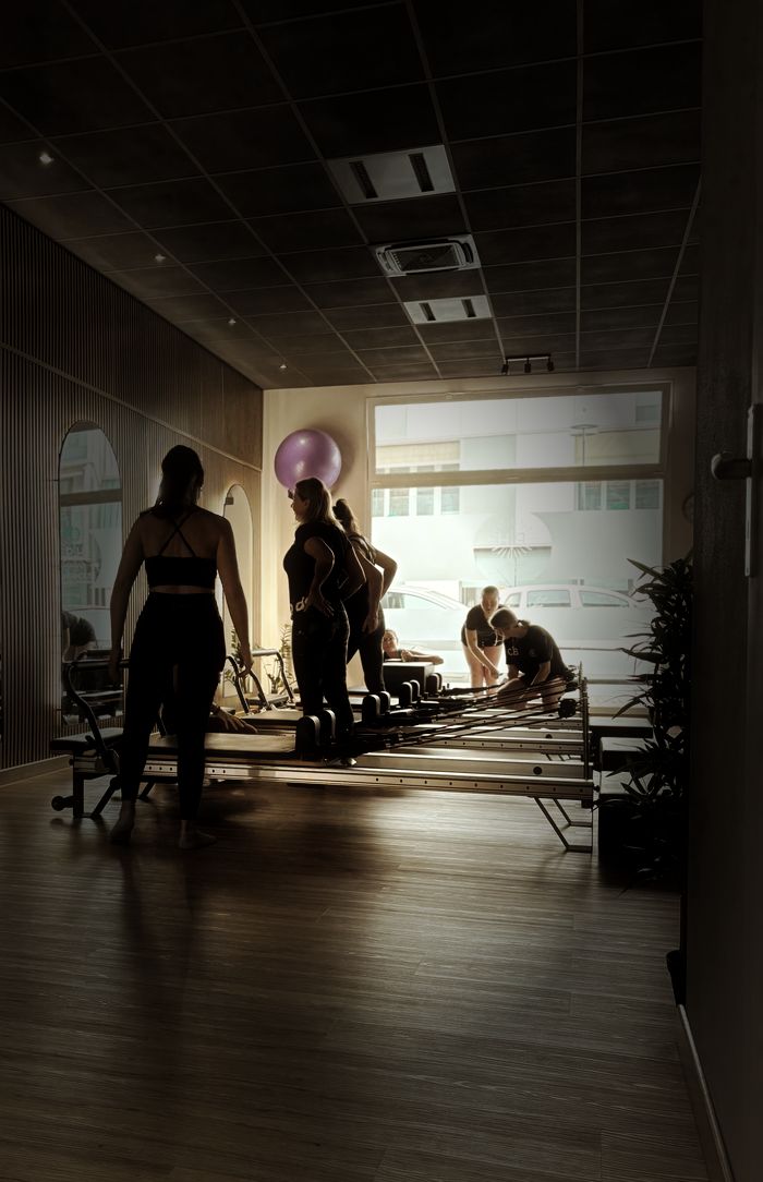 Lezione di gruppo in sala Reformer